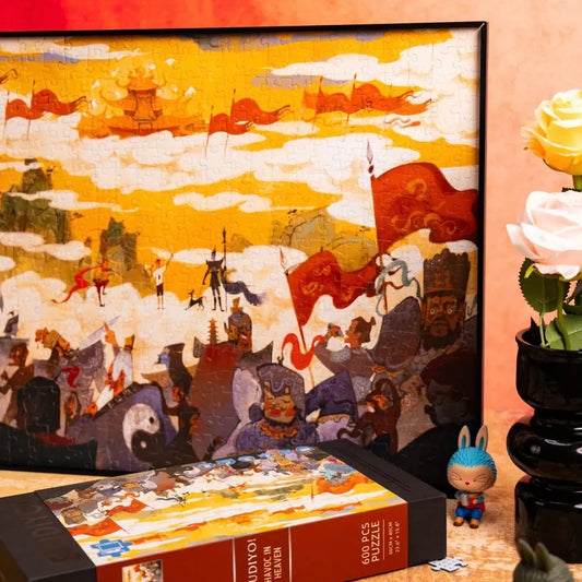Havoc in Heaven is a 600-piece puzzle from StudiYo!. Art by Chou Shui Qiang. It features 2.5D Starry Sand Texture for subtle dimension and sparkle, finished with a soft velvet lamination for a smooth, luxurious feel.&nbsp;Blending classic Chinese aesthetics with intricate craftsmanship, this puzzle is not only a relaxing experience to piece together, but also a beautiful collectible for fans of classic Chin